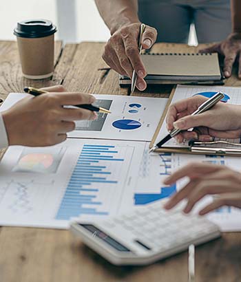 Team reviewing monthly consulting charts